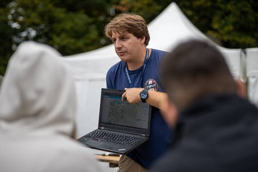 A person holding a computer
AI-generated content may be incorrect.